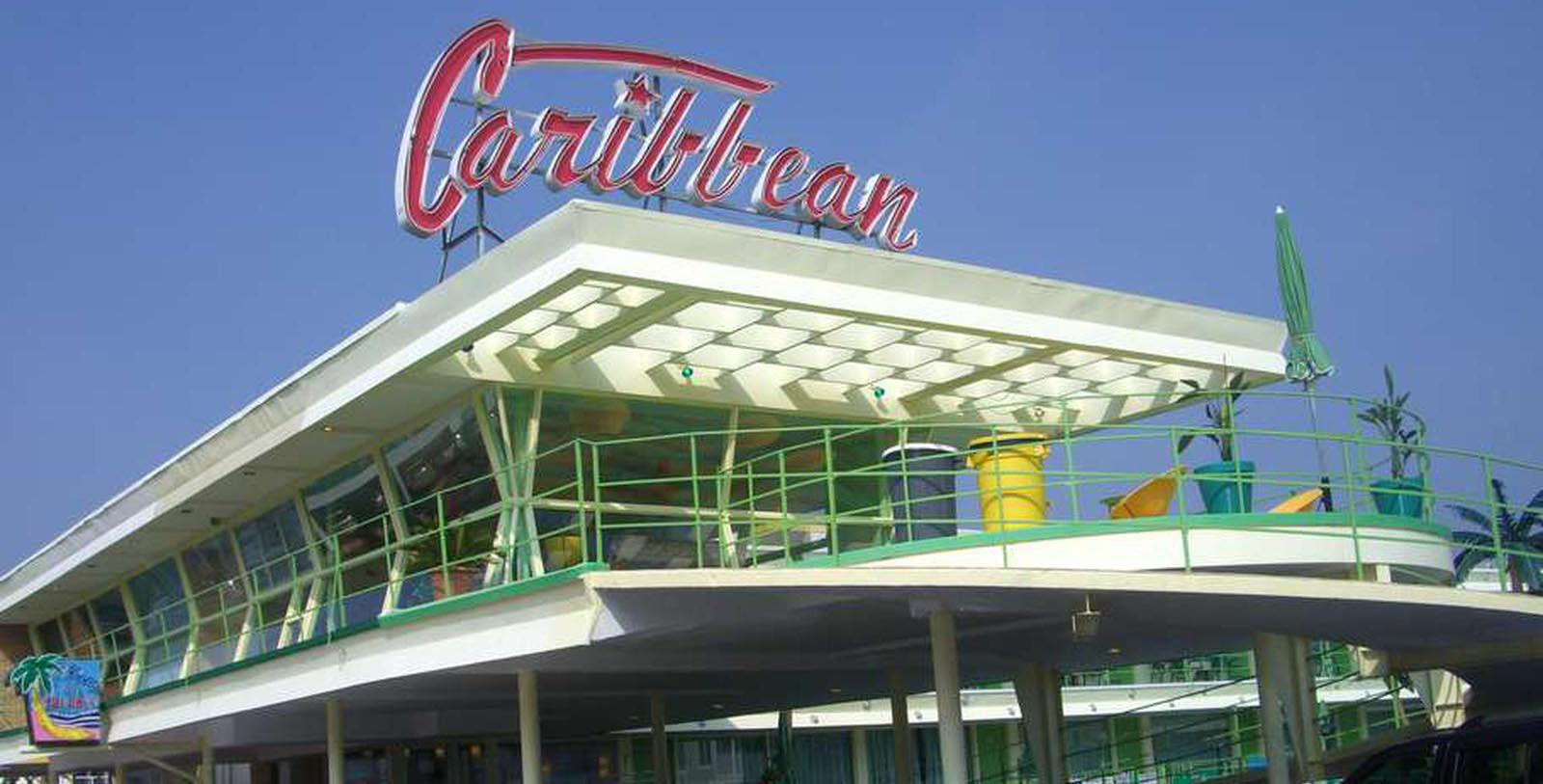 Image of entryway with sign at Caribbean Motel, 1957, Member of Historic Hotels of America, in Wildwood Crest, New Jersey, Discover